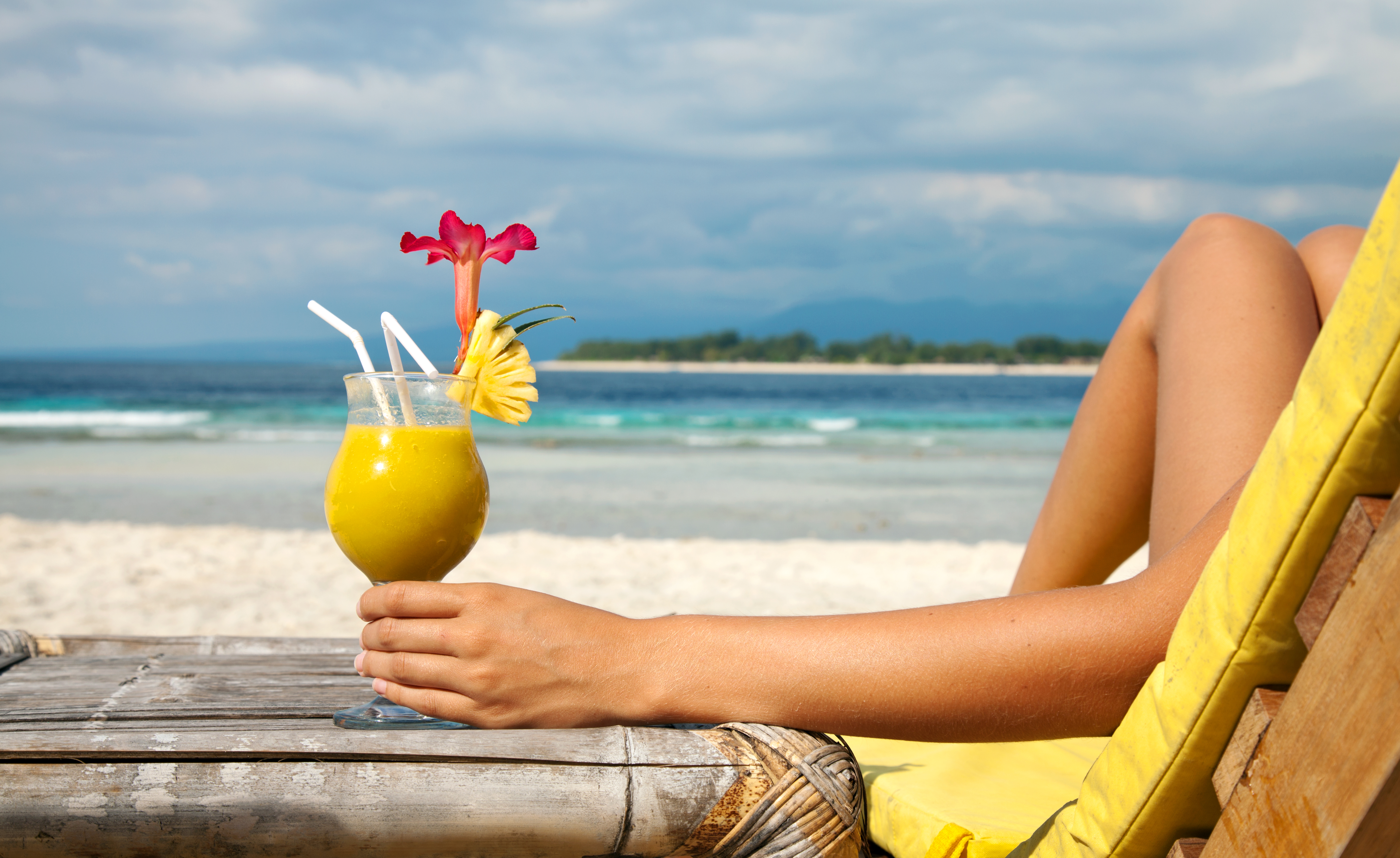 Holding a cocktail on a tropical beach - Diet Free Radiant Me
